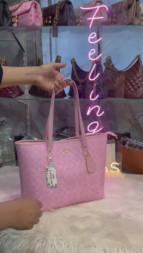 Pink Tote Bag is a stylish and practical accessory designed for everyday use. Made with durable and lightweight material, this bag offers both comfort and long-lasting performance.The spacious interior provides ample room for carrying essentials like books, wallet, makeup, and more. Its elegant pink color adds a trendy and feminine touch, making it perfect for casual outings, shopping, work, or travel.

